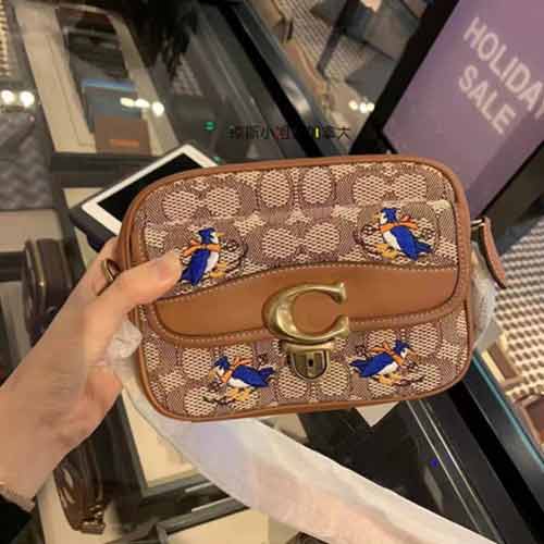 Coach蔻馳Studio 18帆布提花布老花刺繡相機(jī)包C7764