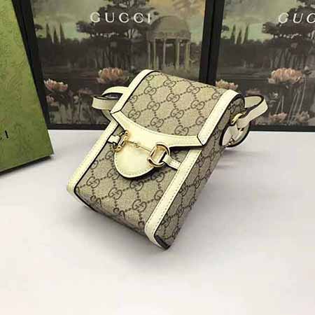 1955馬銜扣老花式手機包，百搭真皮